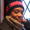 Handmade crocheted hot pink and black ear warmer or headband with two black buttons sewn onto the side by MiasWorkshop