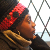Handmade crocheted hot pink and black ear warmer or headband with two black buttons sewn onto the side by MiasWorkshop