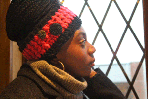 Handmade crocheted hot pink and black ear warmer or headband with two black buttons sewn onto the side by MiasWorkshop