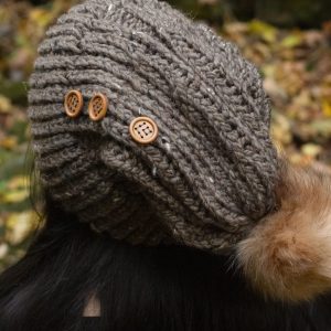 Up close picture of taupe brown hand knit hat with wooden buttons from MiasWorkshop