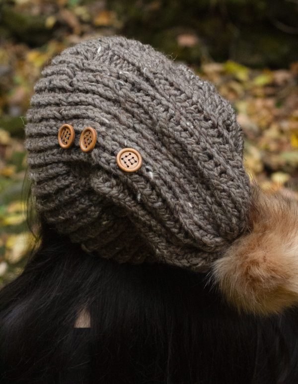 Up close picture of taupe brown hand knit hat with wooden buttons from MiasWorkshop