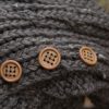up close picture of wooden buttons on hand knit hat from MiasWorkshop