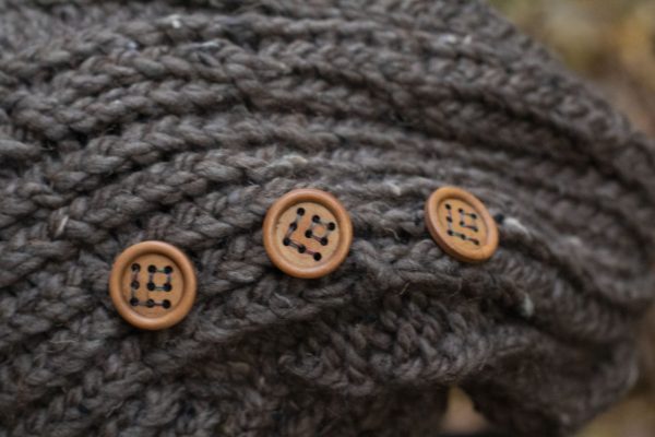 up close picture of wooden buttons on hand knit hat from MiasWorkshop