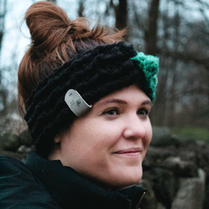 girl wearing vibrant green and black twisted ear warmer or headband from MiasWorkshop