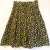 The Spring Lemons skirt is a Lemon pattern pleated skirt with black background. Has pockets and zipper closure. 30 1/2 inch waist. Length of skirt is 27 inches