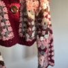 a pink, dark red, cream and dark brown granny square sweater with button closure from Miasworkshop